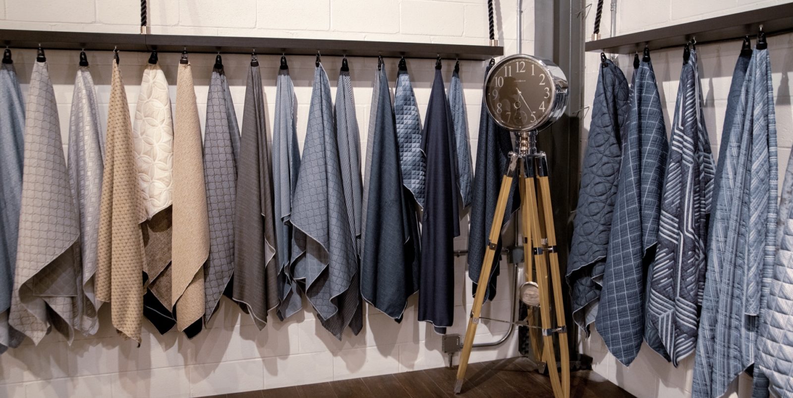 Innovated fabrics hanging on the wall with a clock in the middle