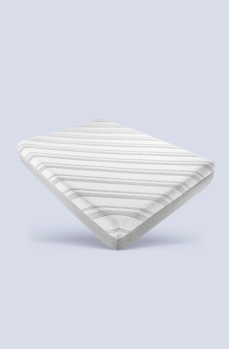 Mattress with striped mattress cover on white and grey background